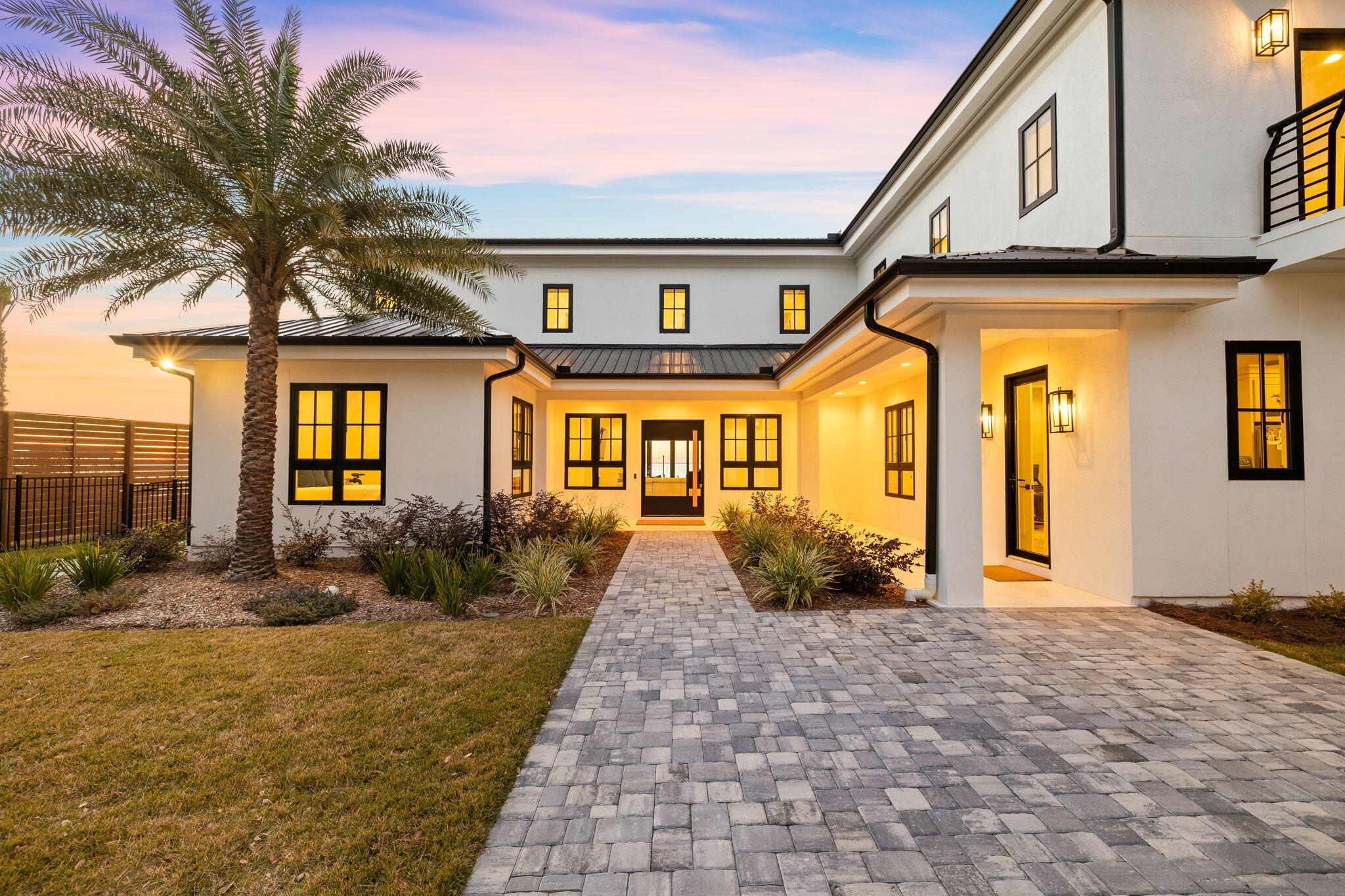253 Driftwood Point Road Santa Rosa Beach, FL 32459 - Photo 4 of 109 a front view of a house with garden