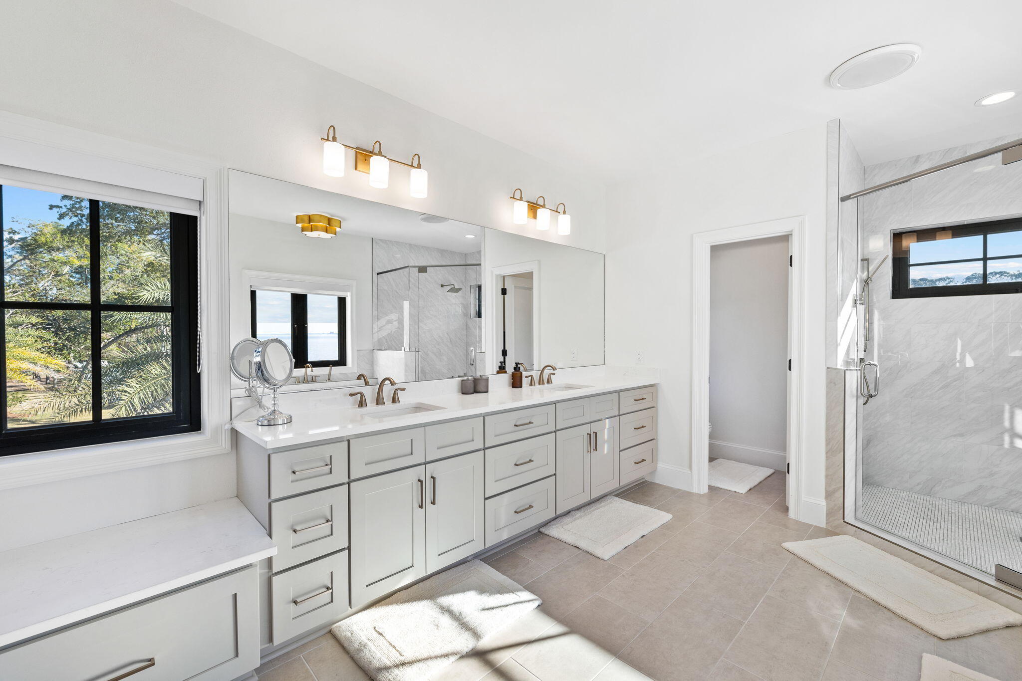 253 Driftwood Point Road Santa Rosa Beach, FL 32459 - Photo 47 of 109 a spacious bathroom with a double vanity sink a large mirror a bathtub and next to a window