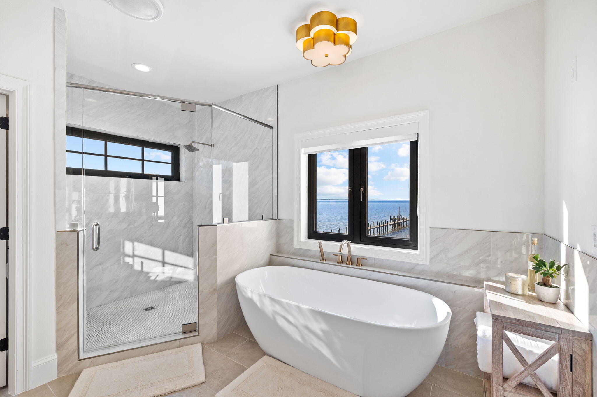 253 Driftwood Point Road Santa Rosa Beach, FL 32459 - Photo 50 of 109 a bathroom with a tub a sink and a large mirror