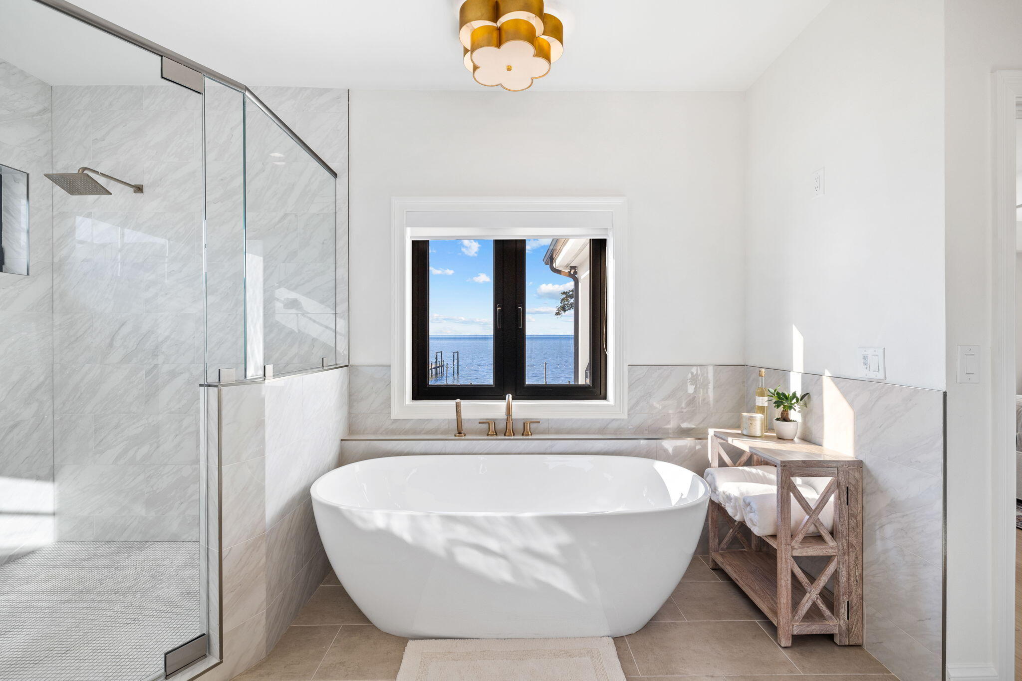253 Driftwood Point Road Santa Rosa Beach, FL 32459 - Photo 51 of 109 a bathroom with a tub and a window