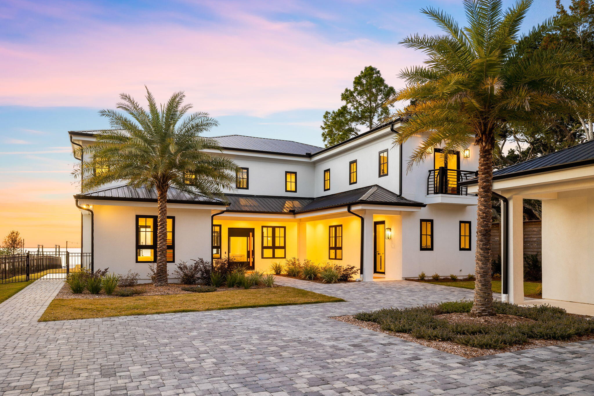 253 Driftwood Point Road Santa Rosa Beach, FL 32459 - Photo 6 of 109 a front view of a house with a yard and garage