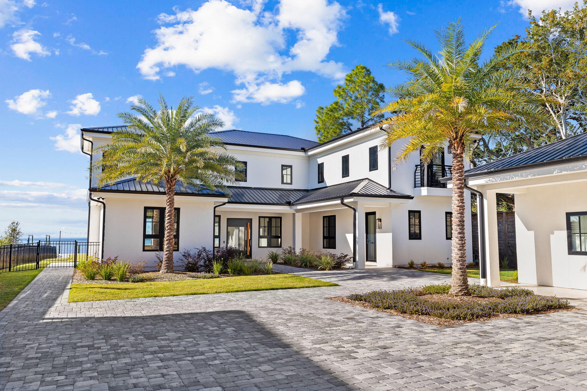 253 Driftwood Point Road Santa Rosa Beach, FL 32459 - Photo 68 of 109 a view of a white house with a swimming pool and a yard