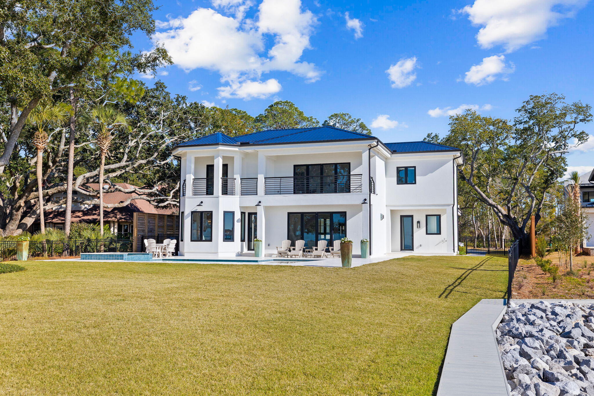 253 Driftwood Point Road Santa Rosa Beach, FL 32459 - Photo 81 of 109 a front view of a building with a garden