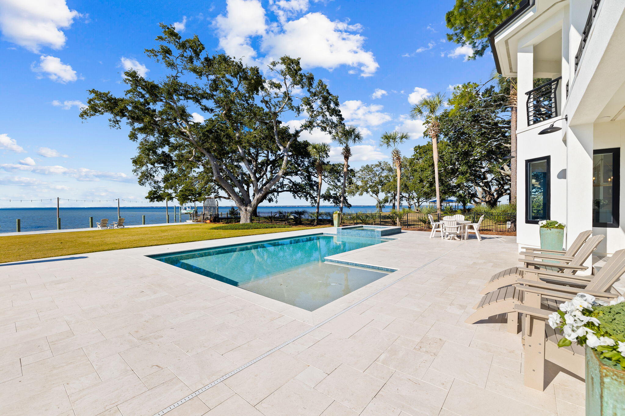 253 Driftwood Point Road Santa Rosa Beach, FL 32459 - Photo 91 of 109 a view of a swimming pool with an outdoor space and seating area
