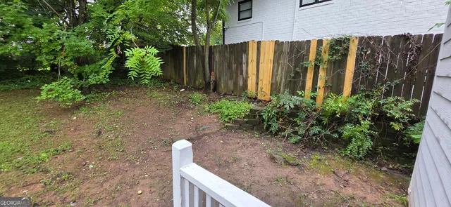 a view of a backyard with plants