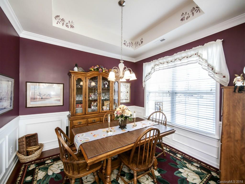 826 Solandra Way Tega Cay, SC 29708 - Photo 2 of 21 a view of a dining room with furniture window and outside view