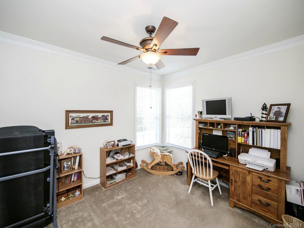 826 Solandra Way Tega Cay, SC 29708 - Photo 15 of 21 a room with furniture and a flat screen tv