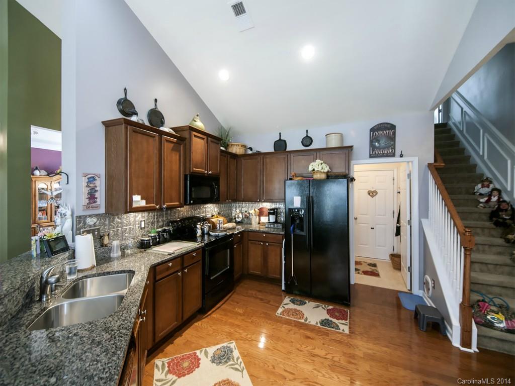 826 Solandra Way Tega Cay, SC 29708 - Photo 7 of 21 a kitchen with refrigerator and countertop
