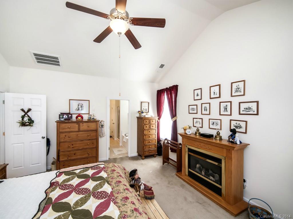 826 Solandra Way Tega Cay, SC 29708 - Photo 10 of 21 a bedroom with a bed and furniture