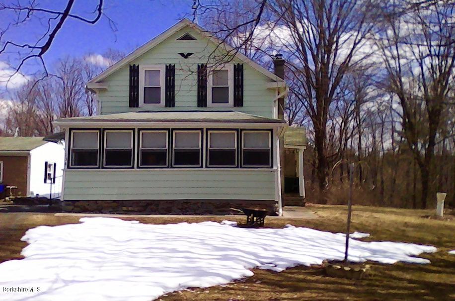 134 Bancroft Road Becket, MA 01223 - Photo 1 of 17 a front view of a house with a yard