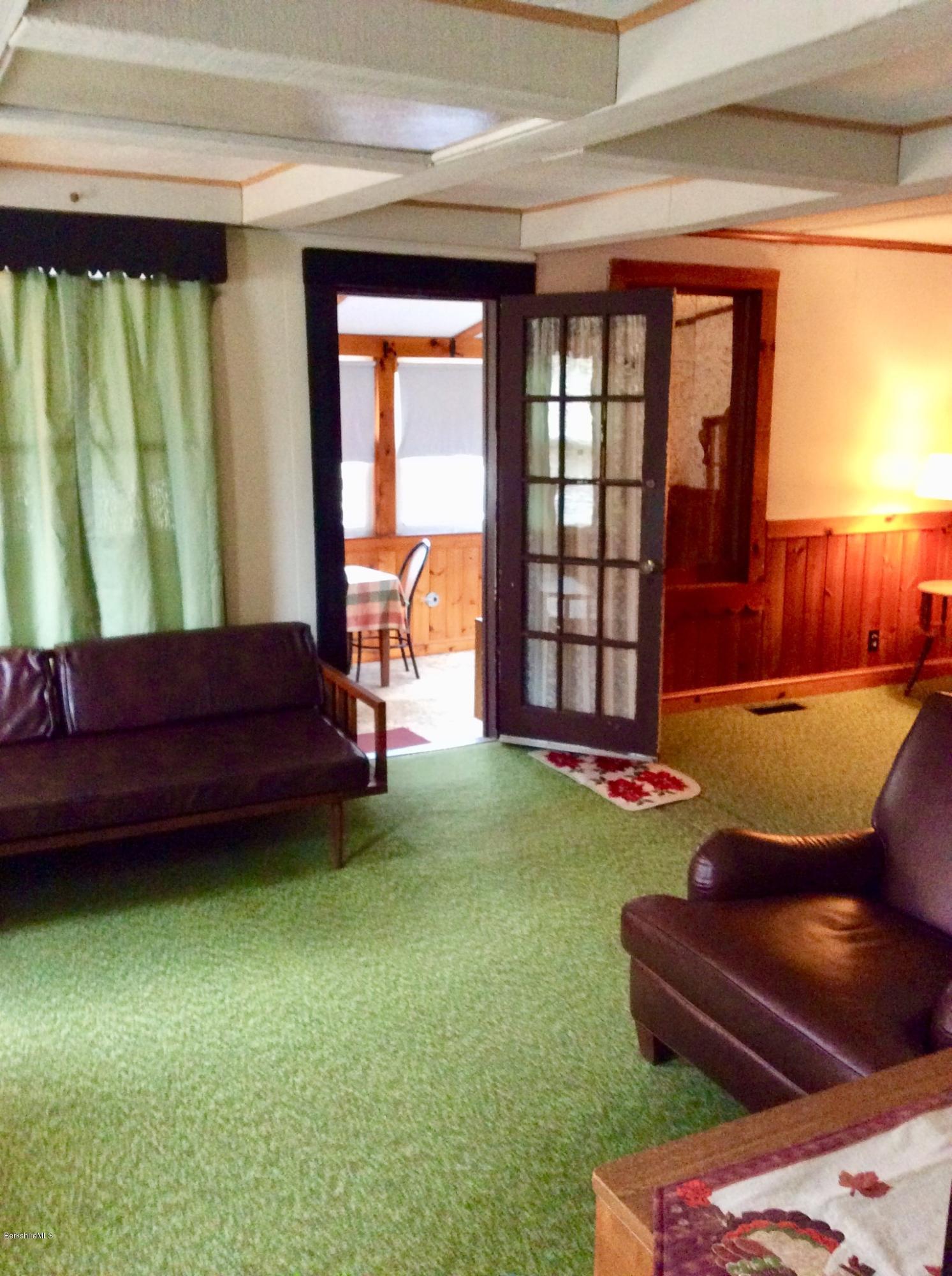 134 Bancroft Road Becket, MA 01223 - Photo 11 of 17 a couch sitting in a room next to a window