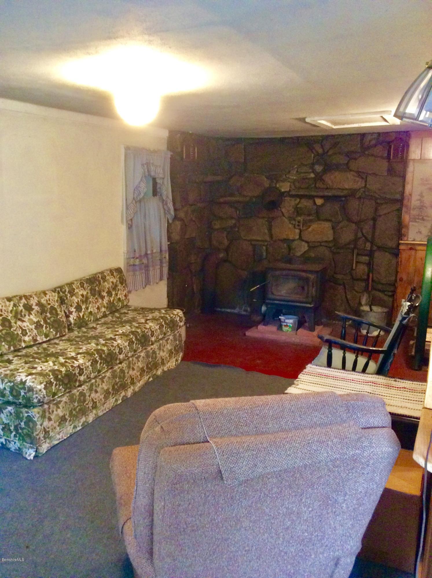 134 Bancroft Road Becket, MA 01223 - Photo 17 of 17 a lamp is sitting in middle of the house