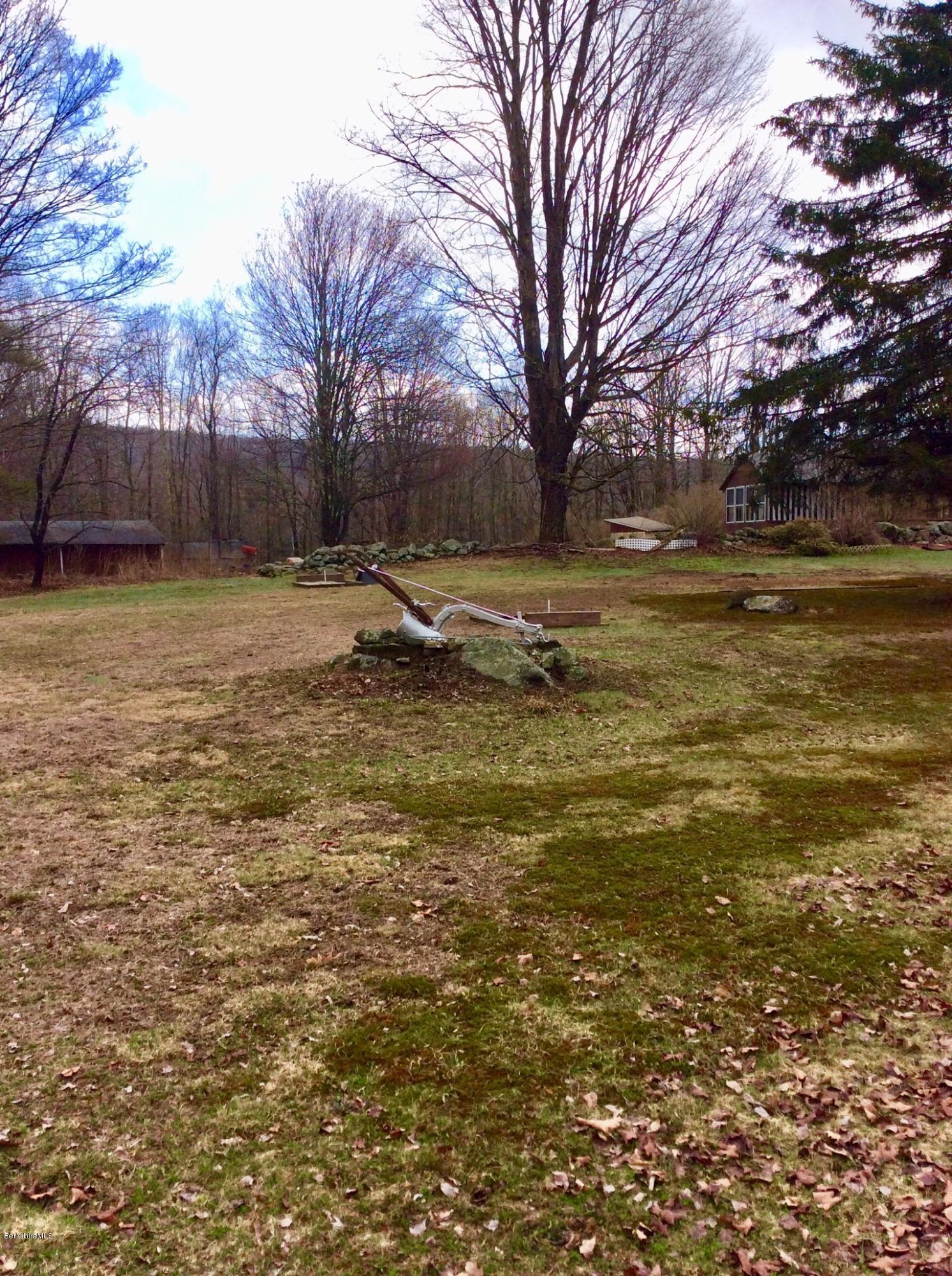 134 Bancroft Road Becket, MA 01223 - Photo 6 of 17 a view of a yard with a house