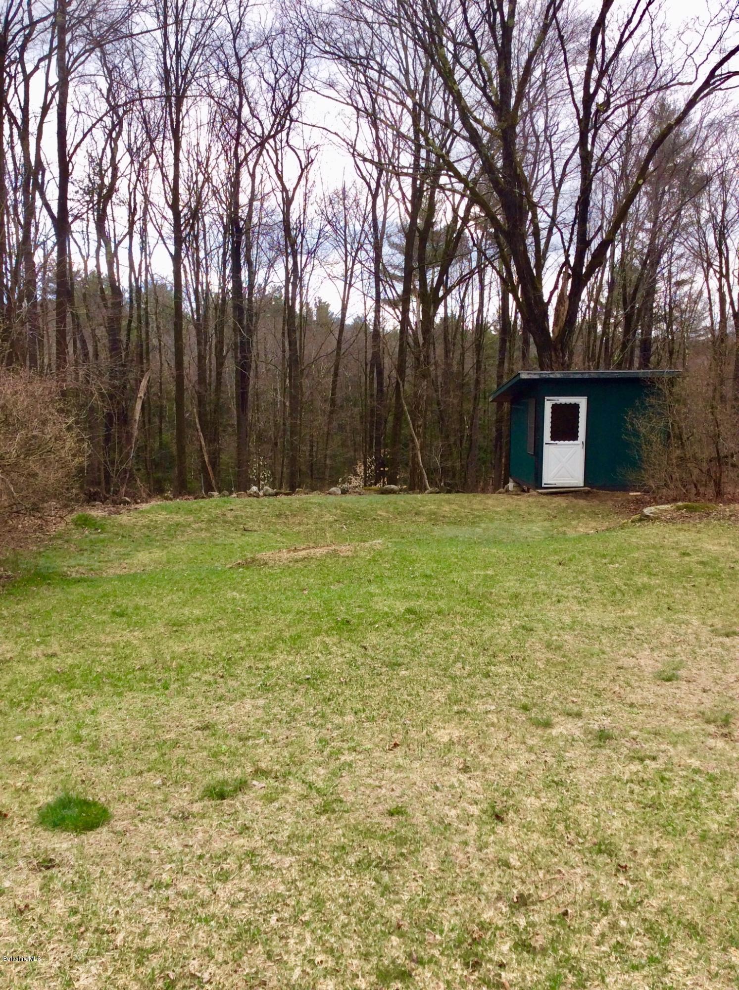 134 Bancroft Road Becket, MA 01223 - Photo 7 of 17 a house with a trees in the background