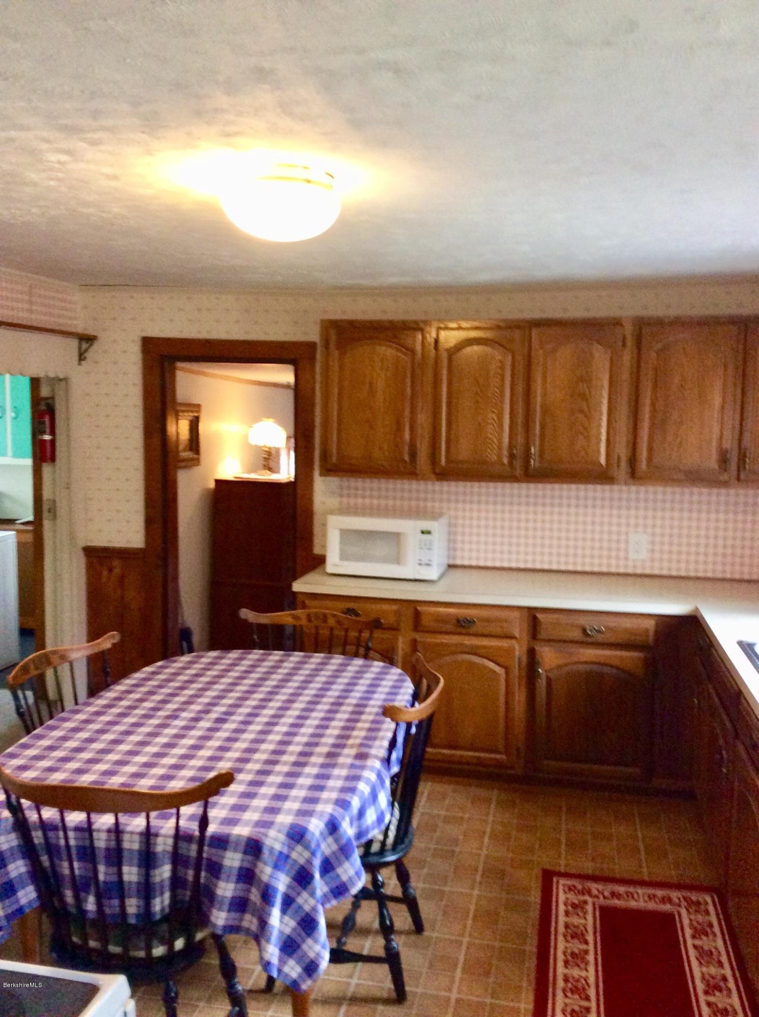 134 Bancroft Road Becket, MA 01223 - Photo 9 of 17 a kitchen with a sink cabinets and window