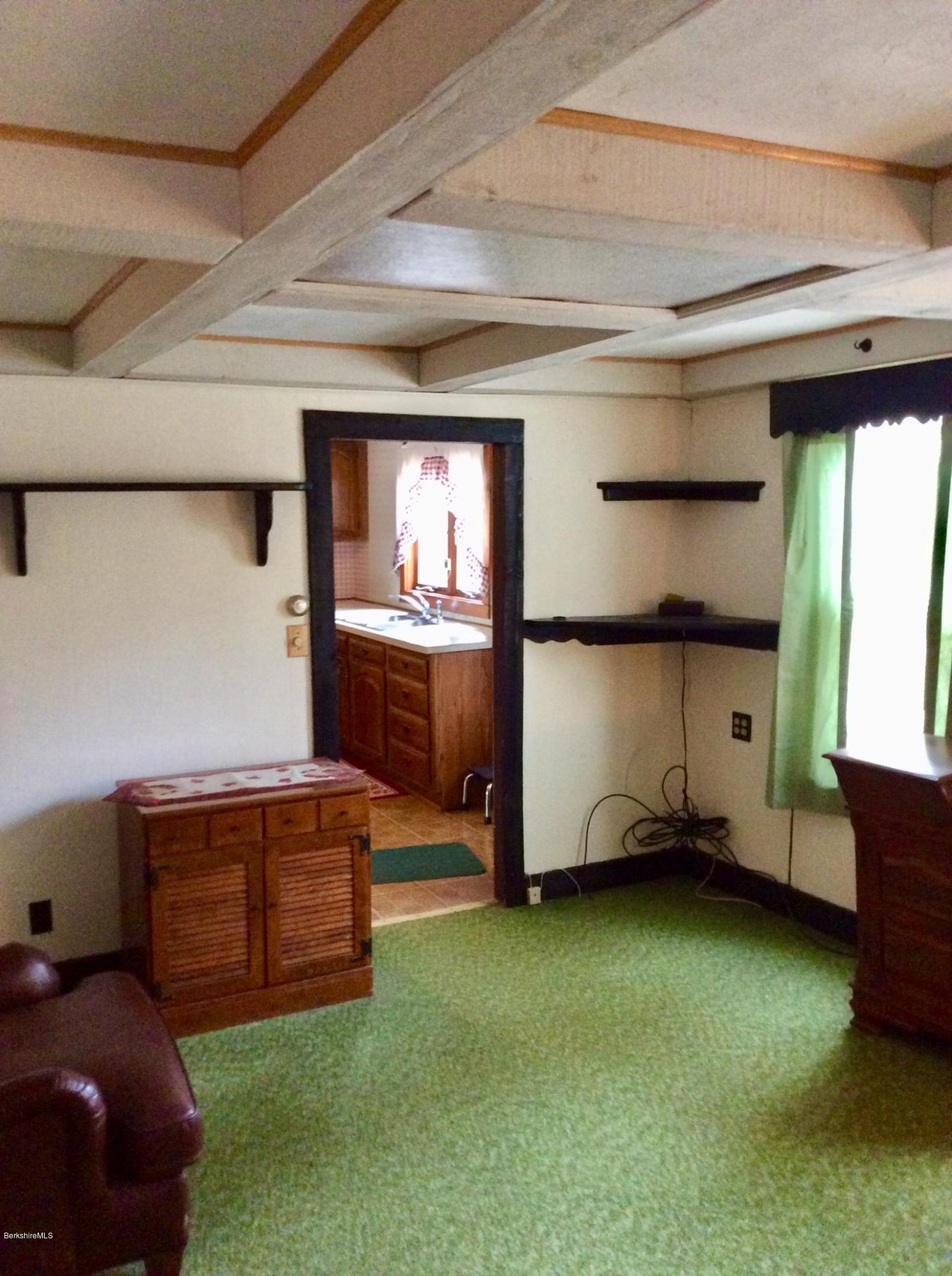 134 Bancroft Road Becket, MA 01223 - Photo 10 of 17 a room with furniture and a window