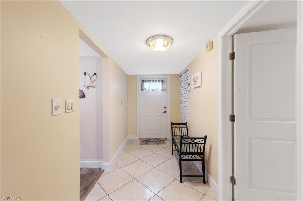 263 Candycane Lane, Unit 5 Naples, FL 34112 - Photo 11 of 49 a view of a hallway with interior of the house