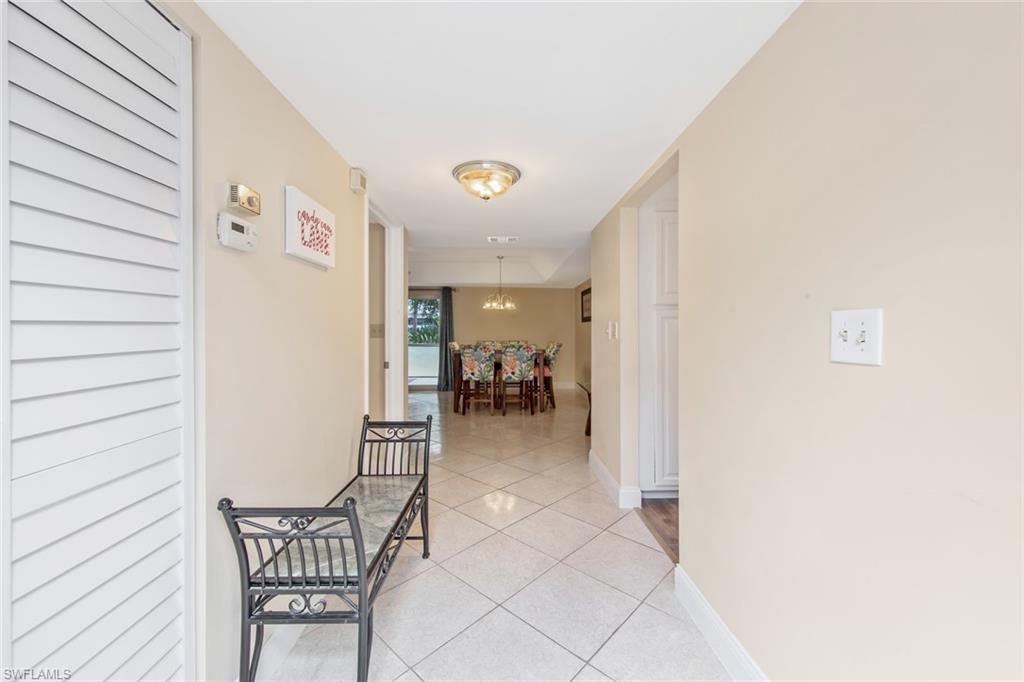 263 Candycane Lane, Unit 5 Naples, FL 34112 - Photo 12 of 49 a view of a hallway with seating area
