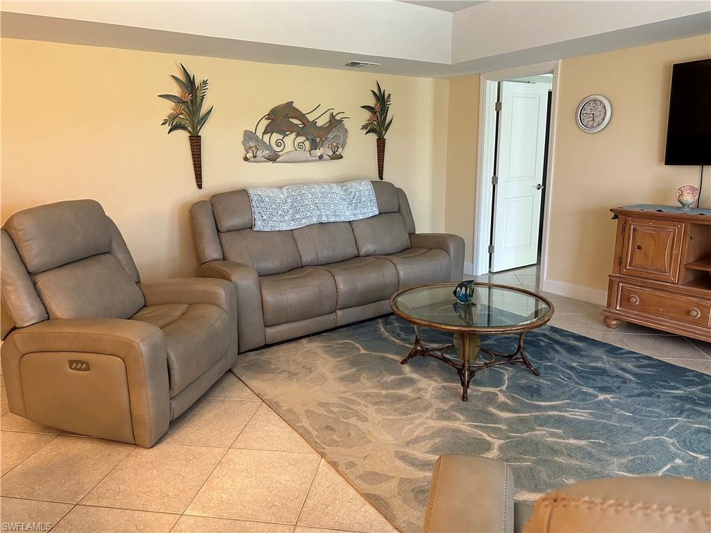 263 Candycane Lane, Unit 5 Naples, FL 34112 - Photo 17 of 49 a living room with furniture and a rug