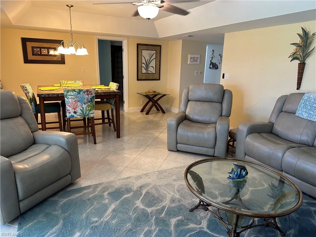 263 Candycane Lane, Unit 5 Naples, FL 34112 - Photo 19 of 49 a living room with furniture and a dining table
