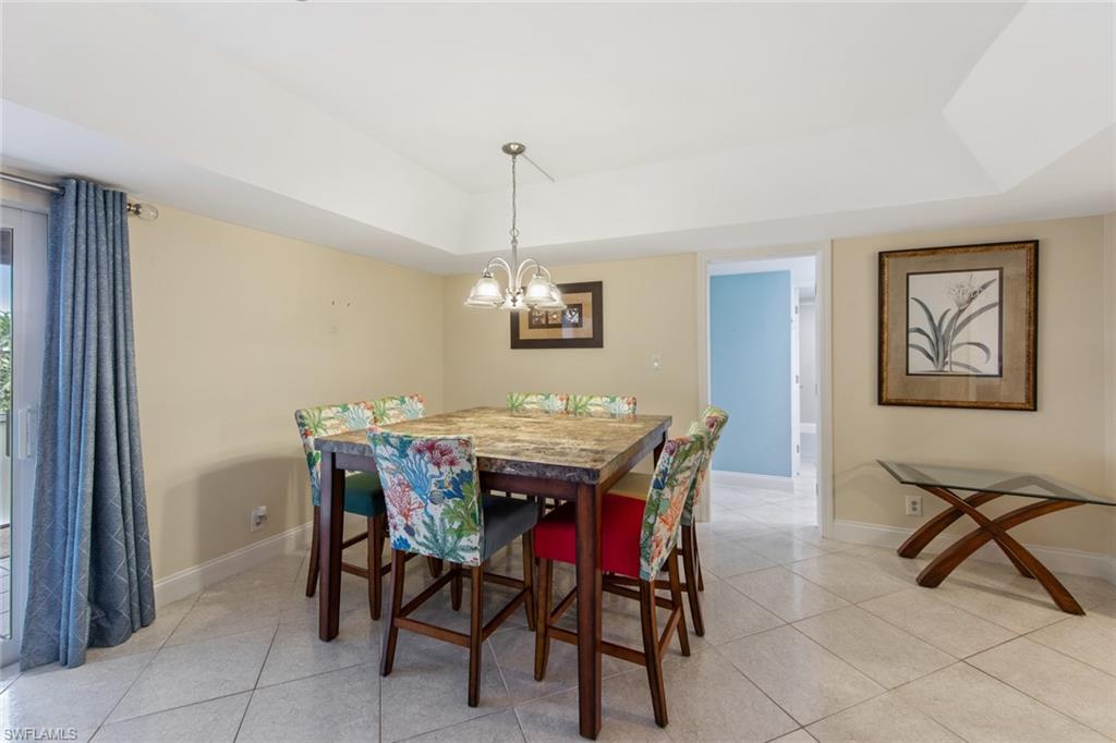263 Candycane Lane, Unit 5 Naples, FL 34112 - Photo 22 of 49 a view of a dining room with furniture