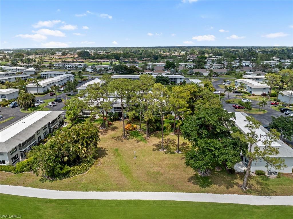 263 Candycane Lane, Unit 5 Naples, FL 34112 - Photo 37 of 49 a view of a city