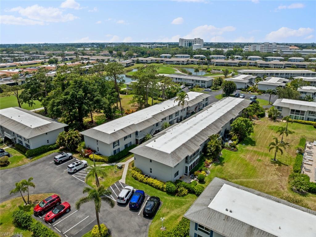 263 Candycane Lane, Unit 5 Naples, FL 34112 - Photo 42 of 49 an aerial view of a house with a lake view