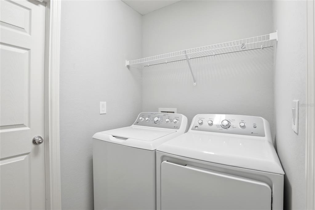 128 Foxtail Loop Davenport, FL 33837 - Photo 25 of 37 a utility room with dryer and washer