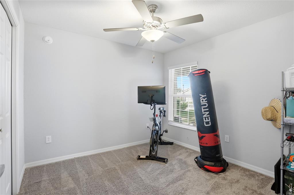 128 Foxtail Loop Davenport, FL 33837 - Photo 26 of 37 a view of room with gym equipment