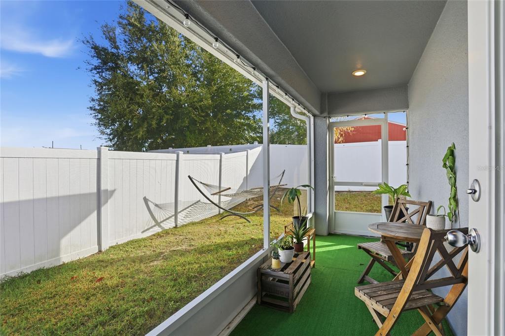 128 Foxtail Loop Davenport, FL 33837 - Photo 27 of 37 a view of swimming pool with seating area