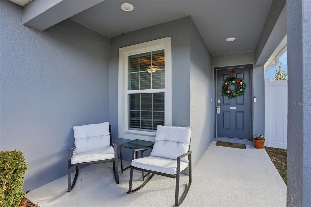 128 Foxtail Loop Davenport, FL 33837 - Photo 3 of 37 a living room with furniture and a window