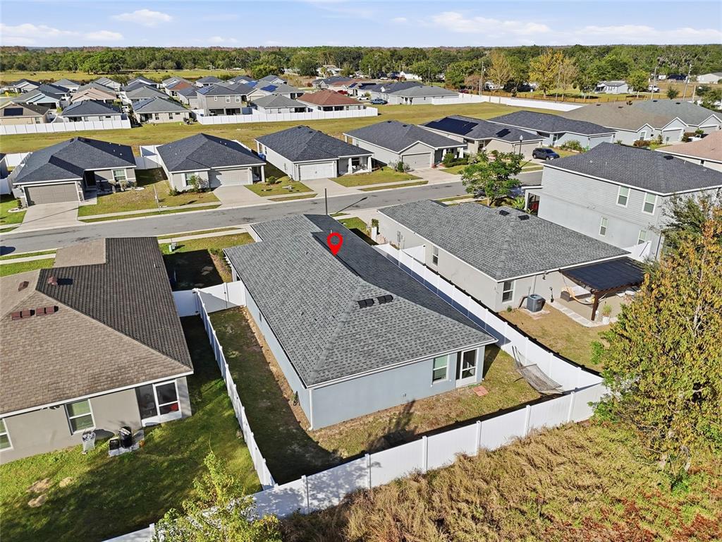 128 Foxtail Loop Davenport, FL 33837 - Photo 32 of 37 an aerial view of a house with a yard