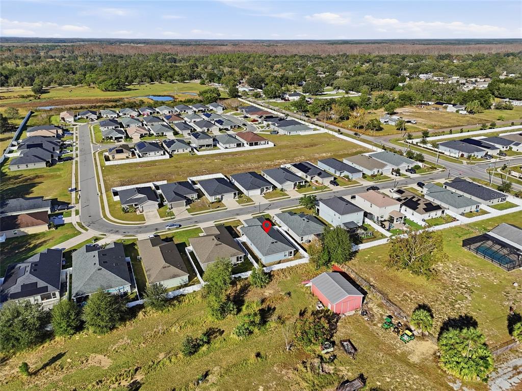 128 Foxtail Loop Davenport, FL 33837 - Photo 35 of 37 an aerial view of residential houses with outdoor space