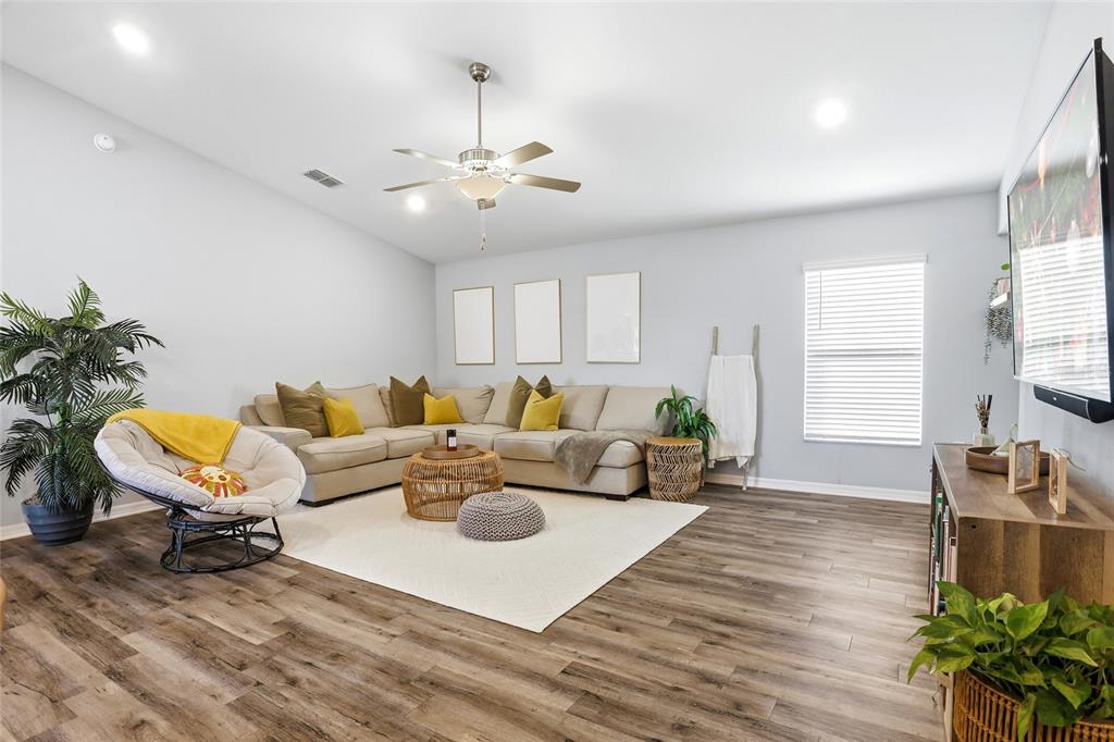128 Foxtail Loop Davenport, FL 33837 - Photo 9 of 37 a living room with furniture