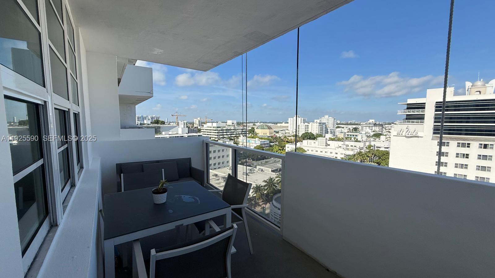 100 Lincoln Road, Unit 1108 Miami Beach, FL 33139 - Photo 15 of 26 a kitchen with a sink cabinets and appliances