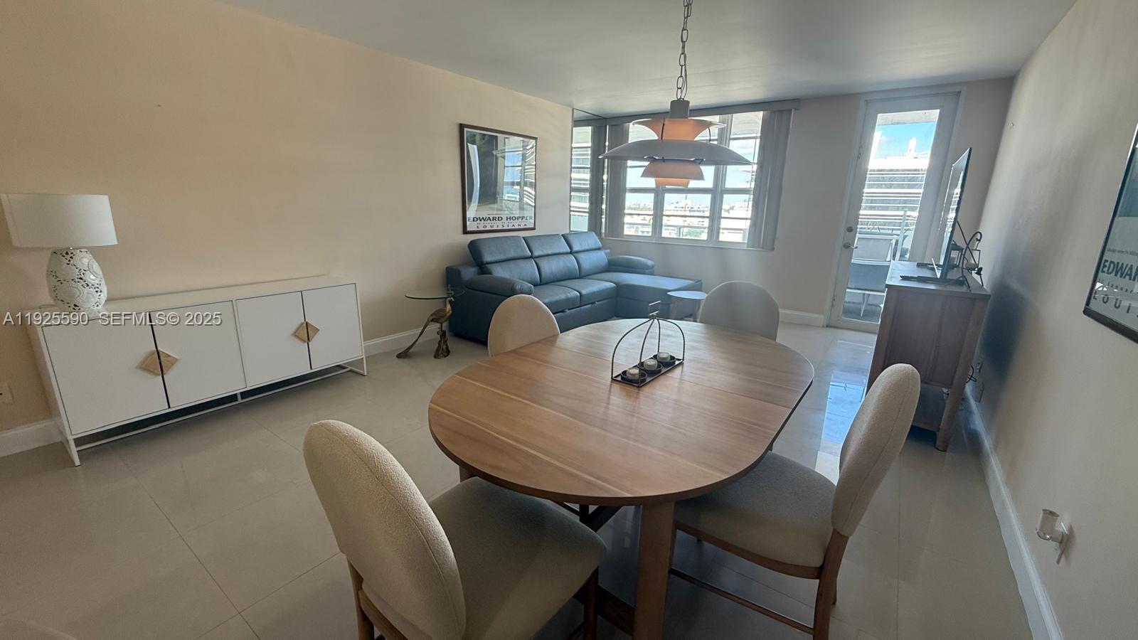 100 Lincoln Road, Unit 1108 Miami Beach, FL 33139 - Photo 3 of 26 a view of a dining room with furniture window and wooden floor