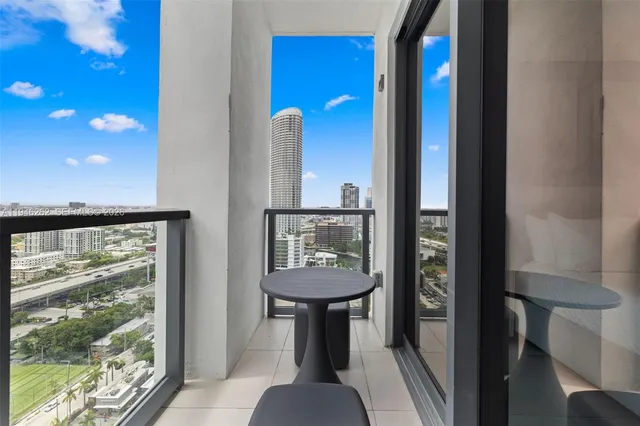 a bedroom with a bed and a night stand