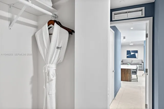 a bedroom with a large bed and a large window