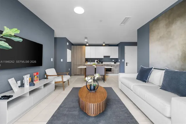 a living room with furniture and a flat screen tv