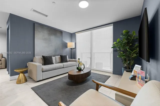 a kitchen with kitchen island granite countertop a sink cabinets and stainless steel appliances