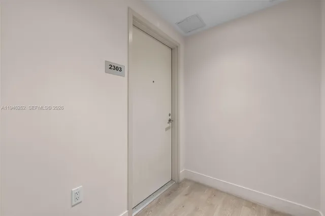 a view of a livingroom with furniture and workspace