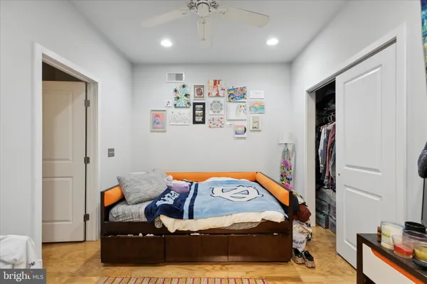 a bedroom with furniture and a chandelier