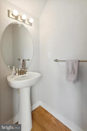 a bathroom with a sink a mirror and vanity
