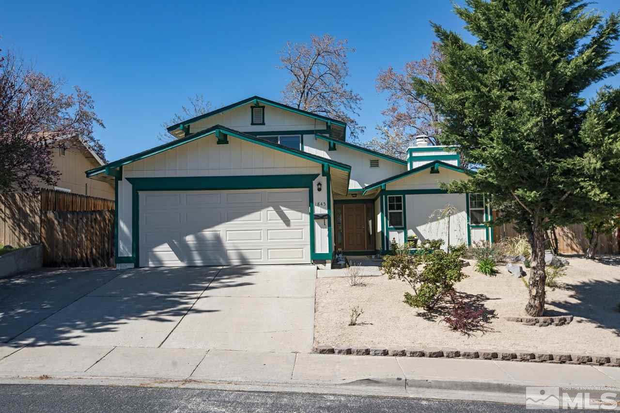 1845 Kings Row Reno, NV 89503 - Photo 1 of 25 a front view of a house with a yard