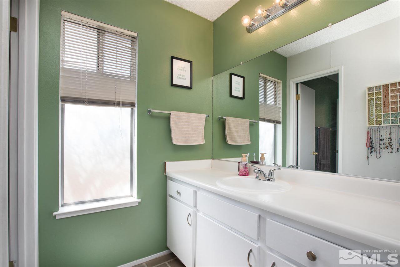 1845 Kings Row Reno, NV 89503 - Photo 14 of 25 a bathroom with a sink and a mirror