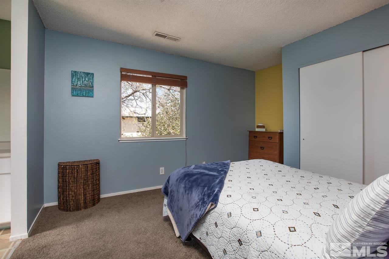1845 Kings Row Reno, NV 89503 - Photo 15 of 25 a bedroom with a bed and a window