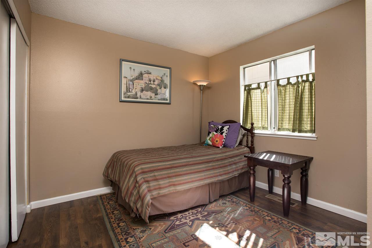 1845 Kings Row Reno, NV 89503 - Photo 16 of 25 a bedroom with a bed and a window