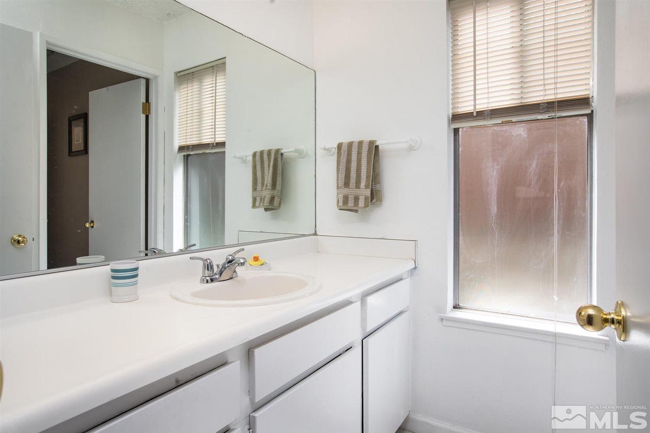 1845 Kings Row Reno, NV 89503 - Photo 19 of 25 a bathroom with a sink and a mirror