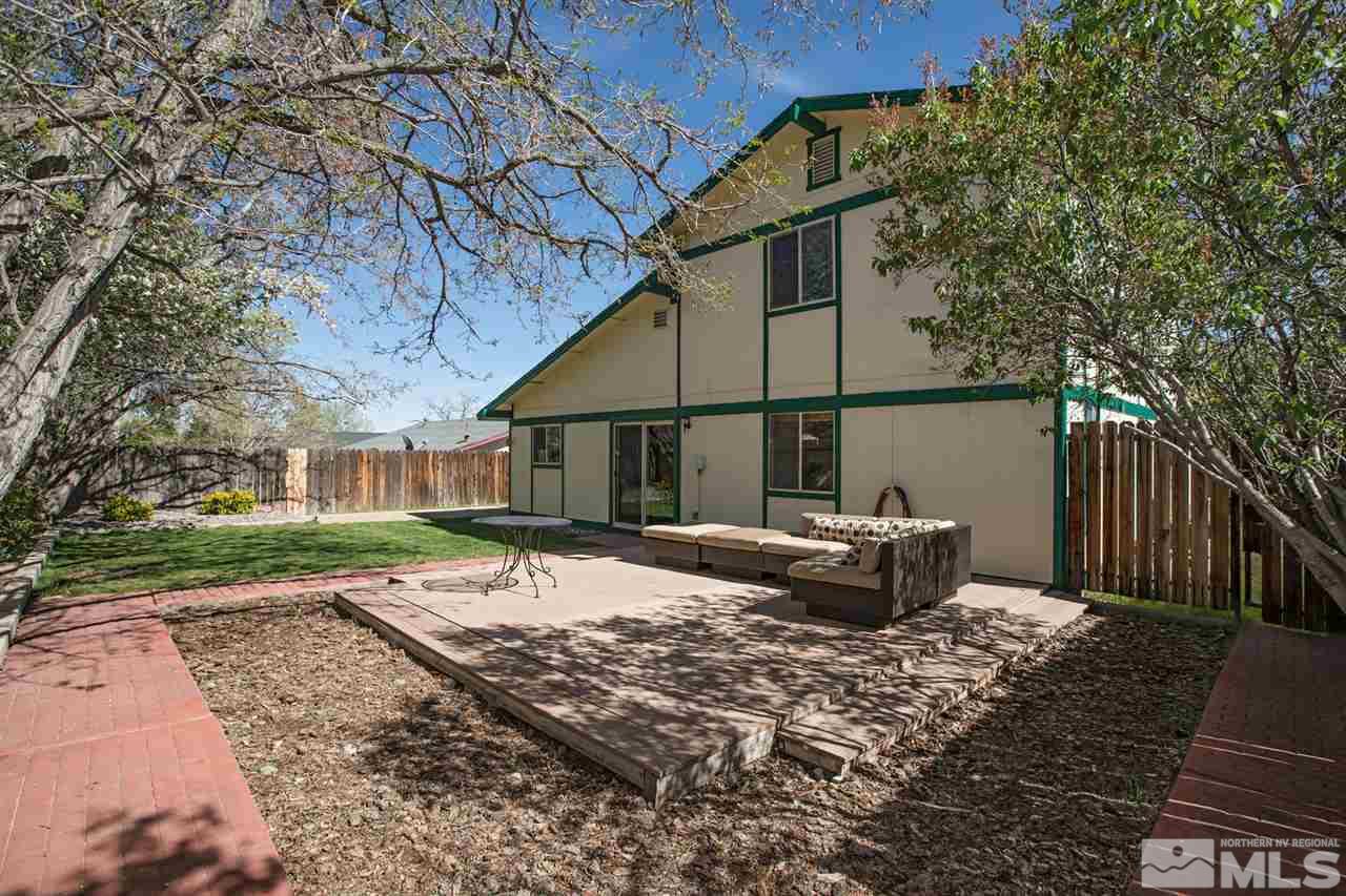 1845 Kings Row Reno, NV 89503 - Photo 23 of 25 a backyard of a house with barbeque oven table and chairs