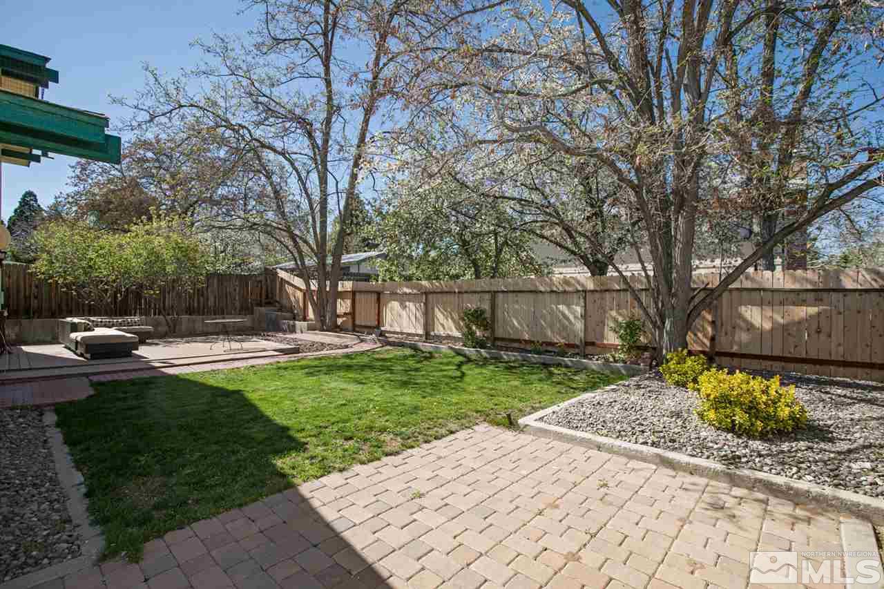 1845 Kings Row Reno, NV 89503 - Photo 25 of 25 a view of a backyard with a garden and trees
